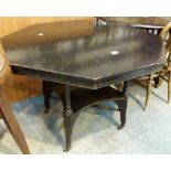 Unusual ebonised octagonal table with under tier and turned stretches