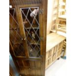 Priory style two door wooden cupboard and a glazed door corner display cabinet