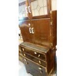 Chest of five long drawers and a vintage kitchen cupboard with leaded glass panel upper doors