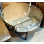 Circular mirrored glass coffee table wit