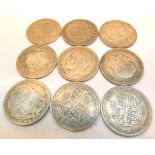 Nine George V half crowns,