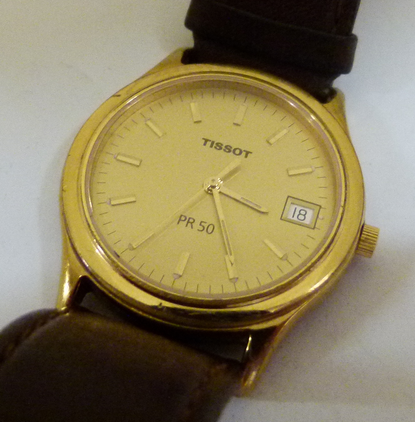 Gents Tissot gold plated watch on a leather strap,