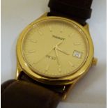 Gents Tissot gold plated watch on a leather strap,