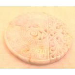 20thC intricately carved Chinese pale green and lavender jade disc amulet,