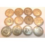 Twelve George V shillings,