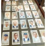 Two framed cigarette card displays with original cards