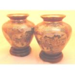 Pair of 20thC Chinese satsuma squat baluster vases, painted with four figural panels,