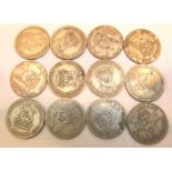 Twelve George V shillings,