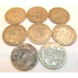 Eight George V half crowns,