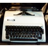 Cased Adler Junior 10 typewriter