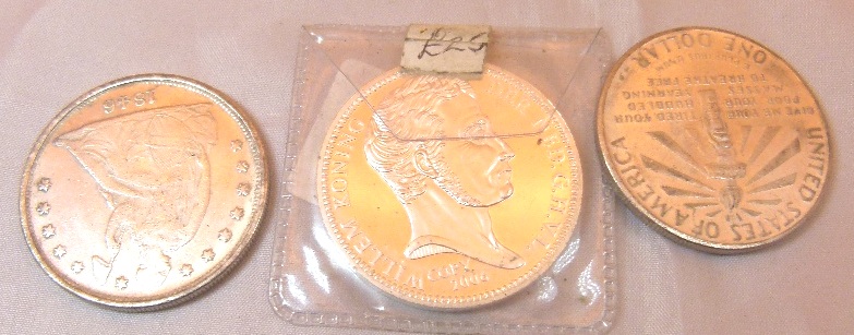 Non magnetic reproduction coins including 1846 Carson City dollar, 1906 Ellis Island dollar,