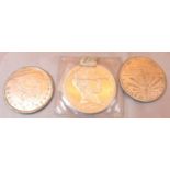 Non magnetic reproduction coins including 1846 Carson City dollar, 1906 Ellis Island dollar,