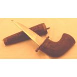 Eastern curved dagger in wooden sheath