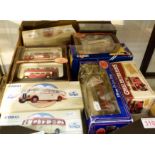 Nine boxed model buses,