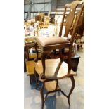 Upholstered chair with ball and claw feet and a shaped table