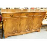 Medium mahogany sideboard with three drawers over three cupboards,