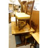 Extending oak dining table with four matching chairs