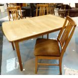 Extending dining table and four matching