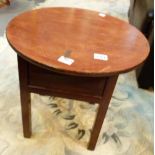 Circular table with lifting lid exposing