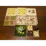 A quantity of 8 assorted Victorian glazed ceramic tiles in various designs and styles