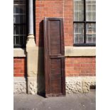 A length of Victorian pitch pine panelling in a dark stained finish H: 185 W: 46 cm