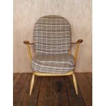 Mid Century beech wood Ercol lounge chair with textured peach coloured upholstery