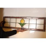 A 1930's leaded glass panel coming with orange border and central flower in yellow and green H: 288