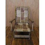 20thC beech framed deckchair with abstract upholstery in cream,