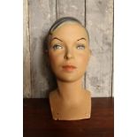 1950's Italian plaster millinery head of a female with dark hair in a side parting