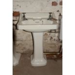 Art Deco style porcelain wash basin with simple chrome taps H: 31 W: 56 cm