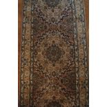 Antique Tabriz runner in a light colourway of cream,