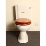 Victorian porcelain Sanitan toilet and cistern with ceramic and brass flush and pitch pine seat H: