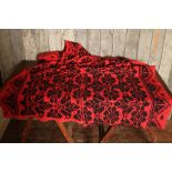 A Mid Century Hungarian fabric rug in a red and black floral pattern 200 x 115 cm