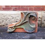 Two Victorian terracotta scroll supports H: 36 W: 30 cm (2 items)