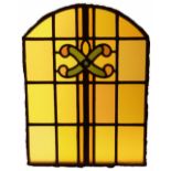 Arch shaped glass panel with red and green cross flower centre H: 53 W: 39 cm