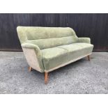 A Mid Century cream and green two tone upholstered sofa with abstract embossed flower pattern and