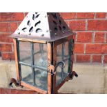 Antique copper free standing lantern on wrought iron legs H: 153 W 33.