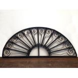 Victorian style wrought steel fanlight grill with repetitive swirl design H: 12 W: 50 cm