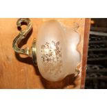 Victorian style brass wall light with simple swirl arms and original Victorian tall peach etched