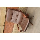Mid Century brown leather swivel lounge chair on a bentwood frame and five star base
