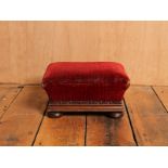 Victorian foot stool with vibrant red patterned velvet upholstery and riveted rim H : 16 W : 30 cm