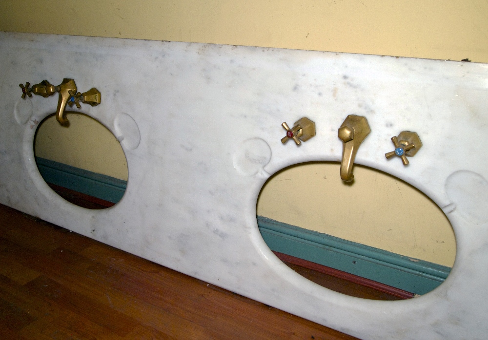 Edwardian marble twin sink surround fitted with two sets of original brass taps L: 229 W: 66 cm