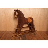 20thC rocking horse on a stained oak frame H : 100 W : 100 cm