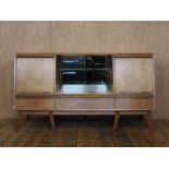 Mid Century oak side board coming with central storage unit with sliding glass doors H : 83 L :