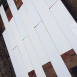 Three hundred white vitrolite glass rectangular tiles H: 81 W: 13 cm