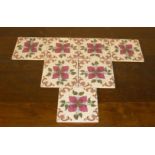 A quantity of 7 Victorian style glazed ceramic tiles with central pink flower