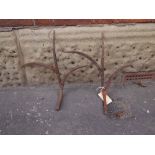 Victorian two pronged cast iron hooks W : 46 cm