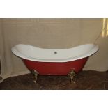 A Victorian style double ended slipper bath in red,