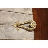 Victorian brass door knocker coming with in a Regency design 20 x 10 cm