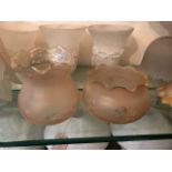 Two Victorian glass peach pearlescent tall shades varying in size with delicate etched foliage